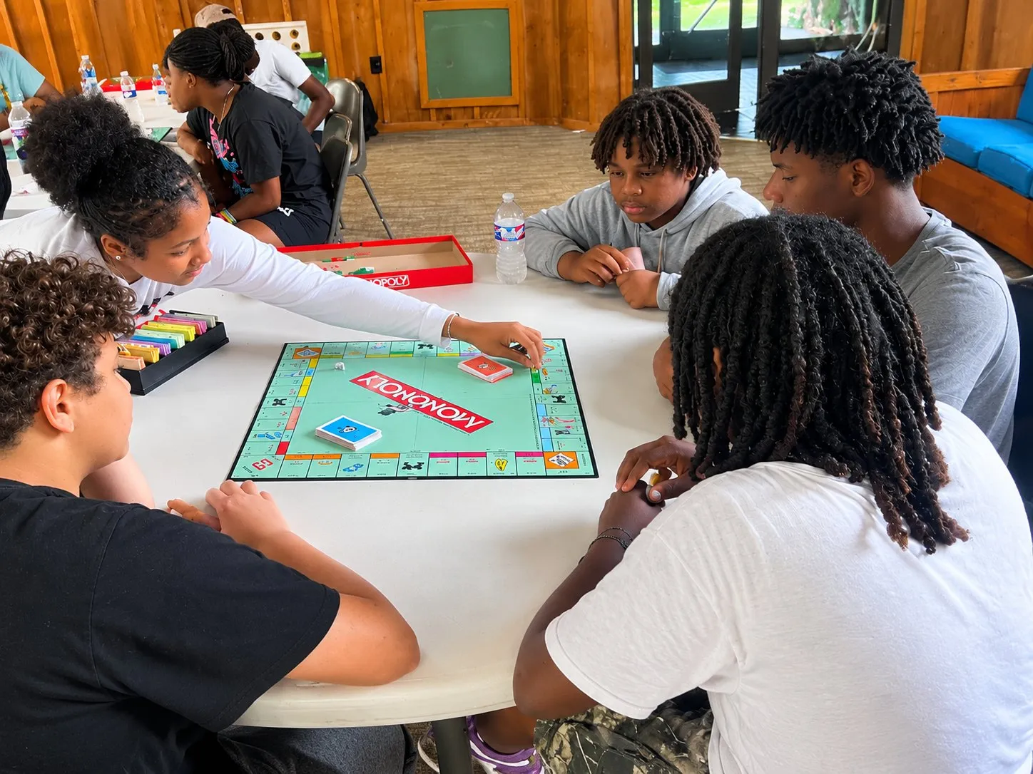 Students playing Monopoly together